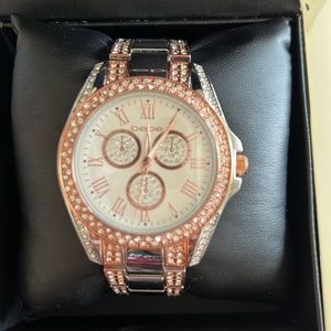 Brand new BEBE rose gold bracelet watch.